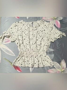 Star-Print Peplum Blouse in White with Black Stars